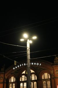 a street light in front of a train station