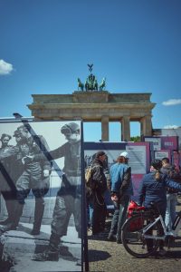 People viewing historical exhibition near brandenburg gate