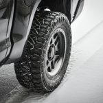 grayscale photo of car wheel