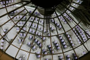 a room with a glass ceiling filled with purple cubes
